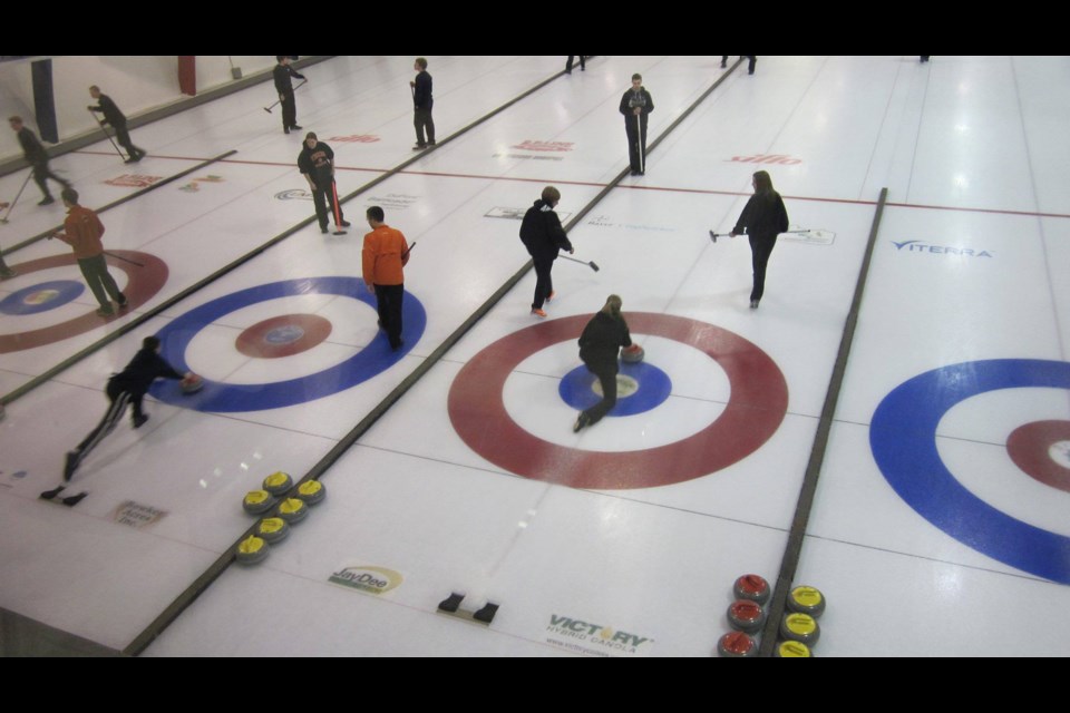 An overhead view of five sheets in action at the Unity Curling Club.