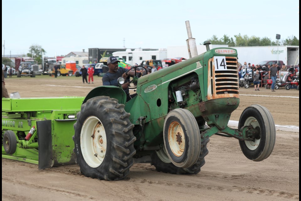 An Oliver digs in its front tires rising above the track.