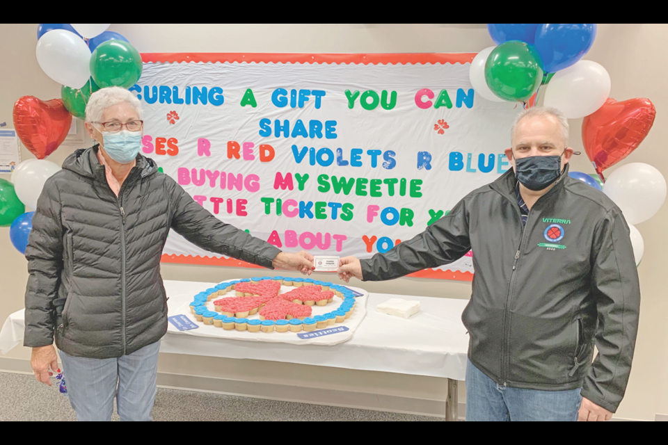 Rosalie Fjeldberg purchased the first ticket to the Viterra Scotties Ladies Curling Championship from Mike Broda, during the kickoff to ticket sales. 