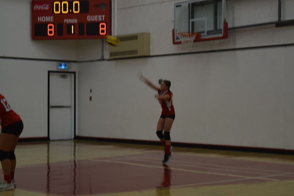 During junior girls volleyball action versus the visiting Kamsack Spartans on October 5, Makayla Heshka of the Canora Cougars Red Team (Grade 8 and 9) fired a strong serve over the net. / Rocky Neufeld