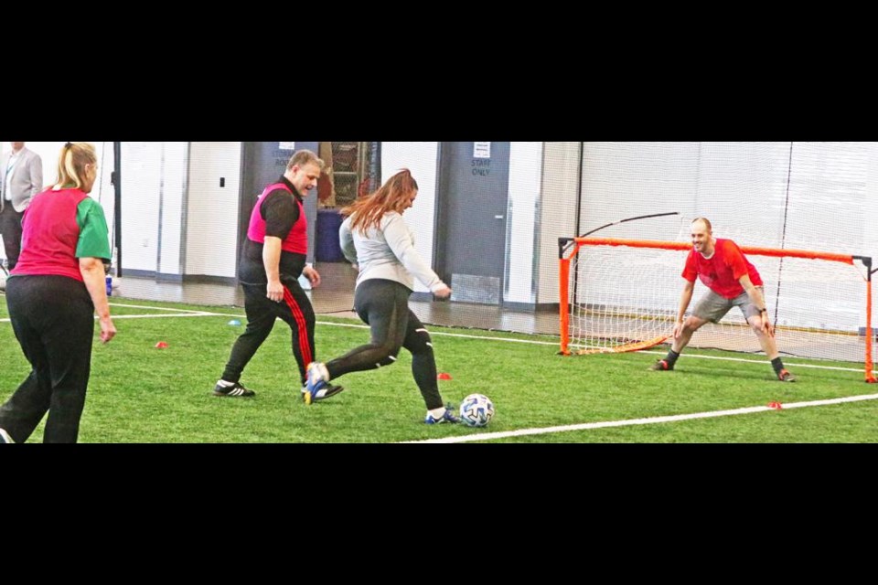 There were six teams formed altogether to try out walking soccer on Saturday. Jason Roy can be seen here to the left of the centre player, helping to demonstrate the sport.