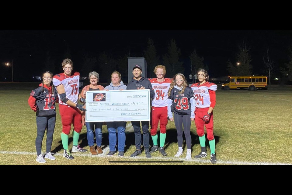 UCHS Warriors presented $1,141 to Unity's mental wellness group that was raised at their game Sept. 29.  In the photo are Kaitlyn Nestman, Logan Middleton, Pam Welter, Jennifer Wilson, Kyle Clark, Tanner Wilson, Kierra Bosch and Shea Berger.