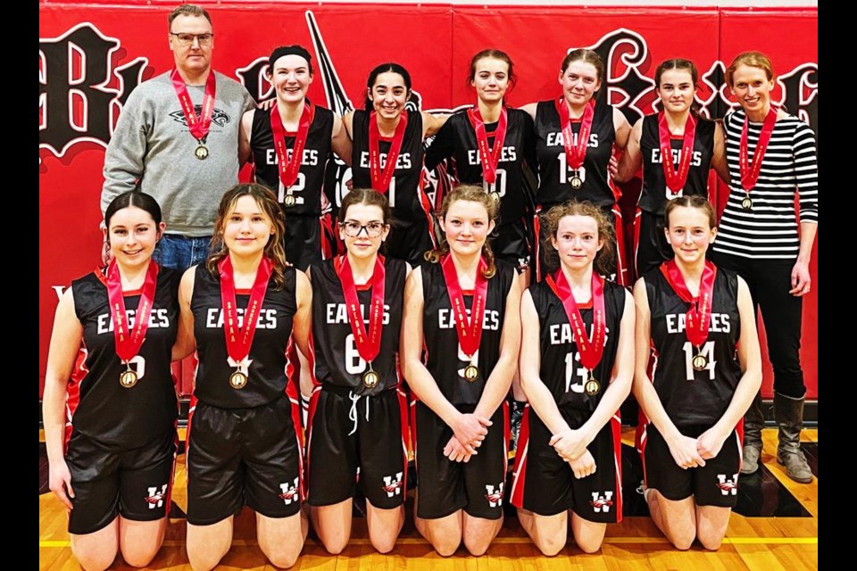 The U14 WCS Eagles junior girls team gathered with their medals after winning as district champions in Oxbow on Wednesday.