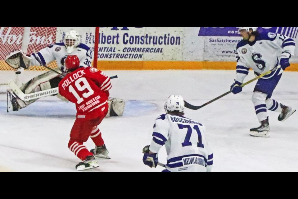 Simon Pollock of the Weyburn Red Wings fired from in front of the Melville net, but goalie Jared Thompson was able to glove his shot. Pollock had scored earlier to make the game 2-1, which ended up as the final score.