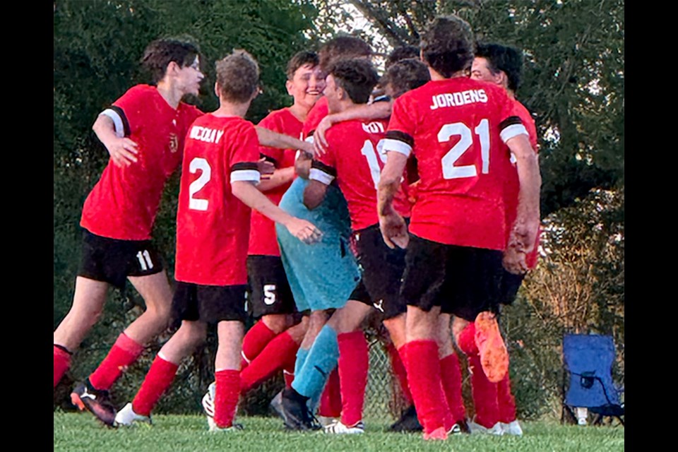 As soon as the referee whistled the end of the game on July 9, there was jubilation by the players as they came to congratulate their winning goal keeper, Jesse Travis.
In the foreground are Caleb DuHamel, Tyson Nicolay, and Ranson Jordens In the background are Hayden Frank, Canaan Braun, Jesse Travis, Lexington Roy, Jaxon Porter, and Jevon Doud.