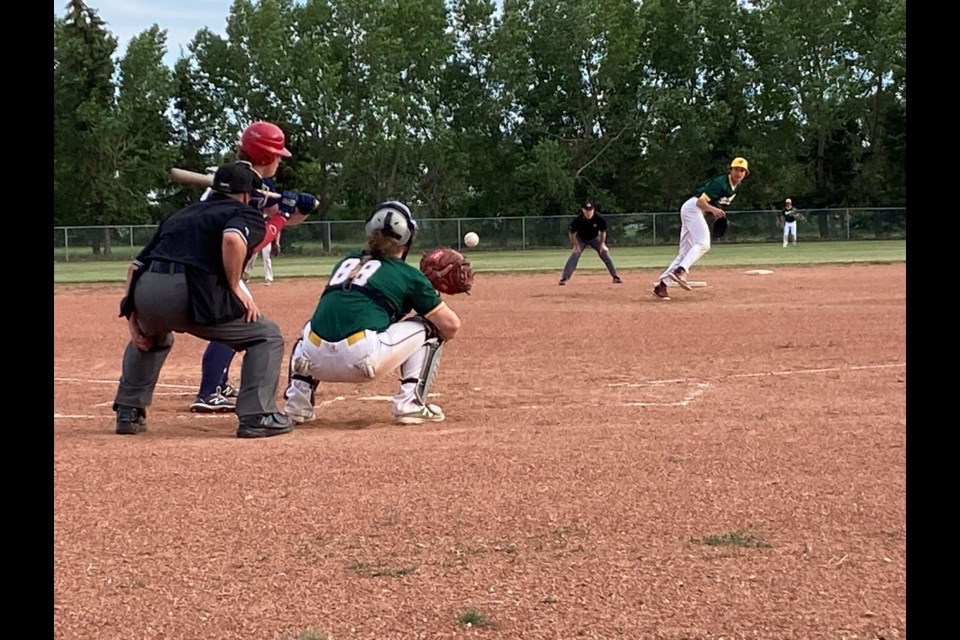 Gavin Wourms pitches a ball to catcher Braden Poleris in a June 28 game in Wilkie.