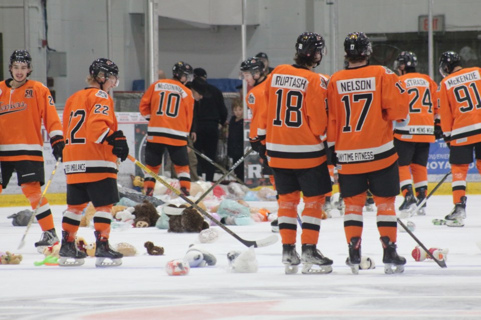 The team clearing the ice of the 226 teddy bears.
