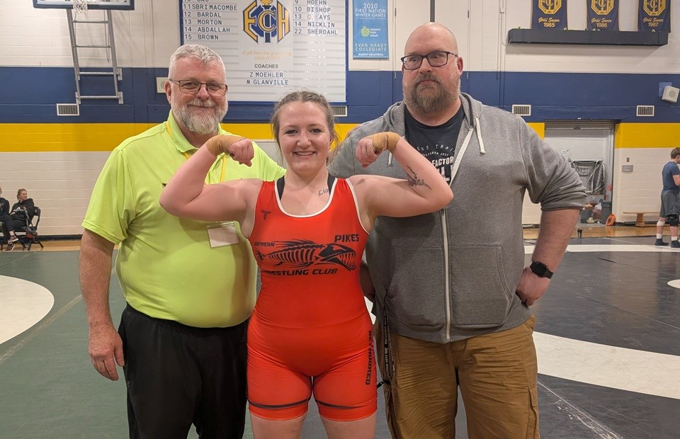 Following the Team Sask trials, Avi'endha Beaugrand poses with Coach Chris Brownrigg (left) and Coach Chris Kent (right) after learning she had secured a spot on the team.