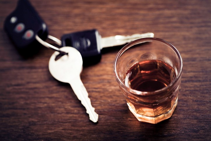 A glass of whisky and a set of car keys