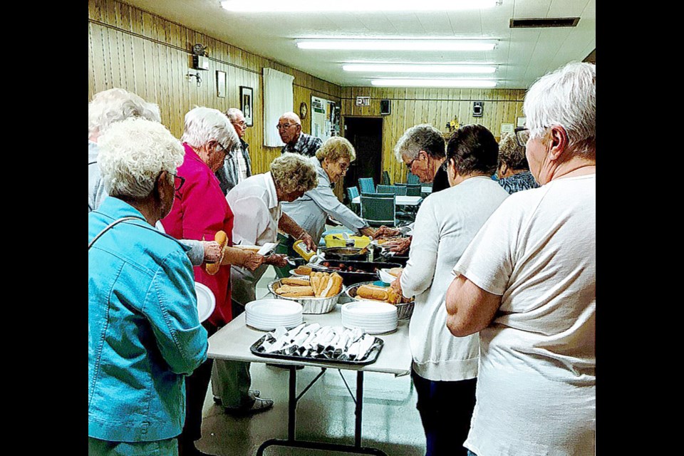 After more than a year of pandemic restrictions, Action Now members were enthusiastic to line up for food at their re-opening event July 21. 