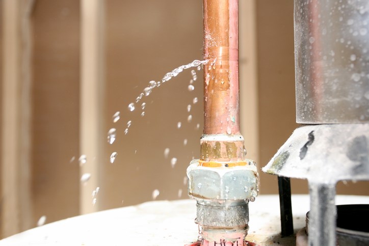 Close-up of drain pipe leaking water