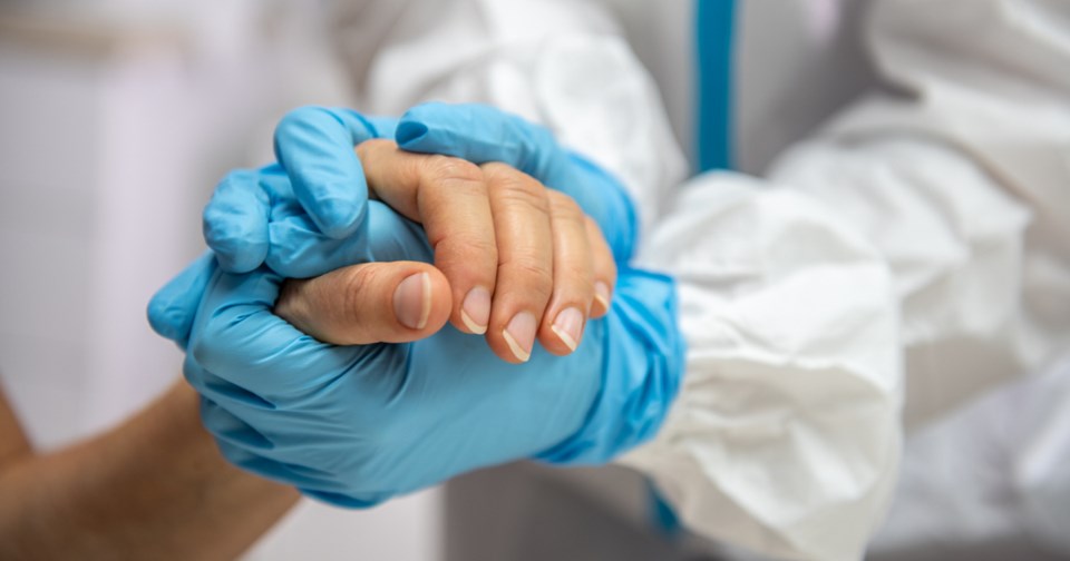 Healthcare worker giving support and love to a patient