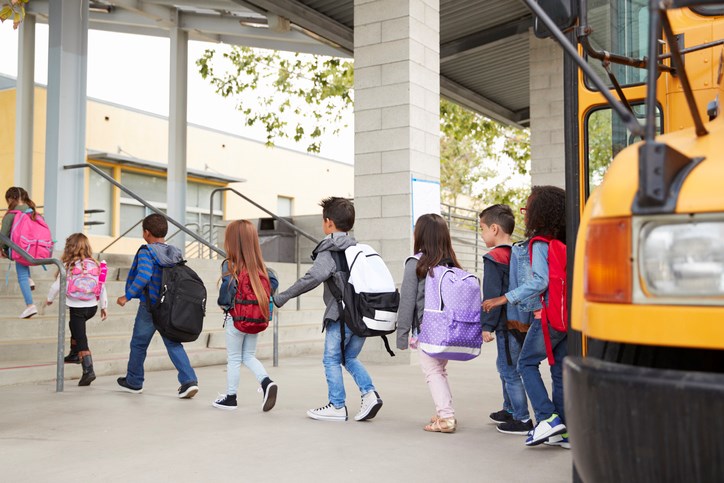 Kids walking to the bus