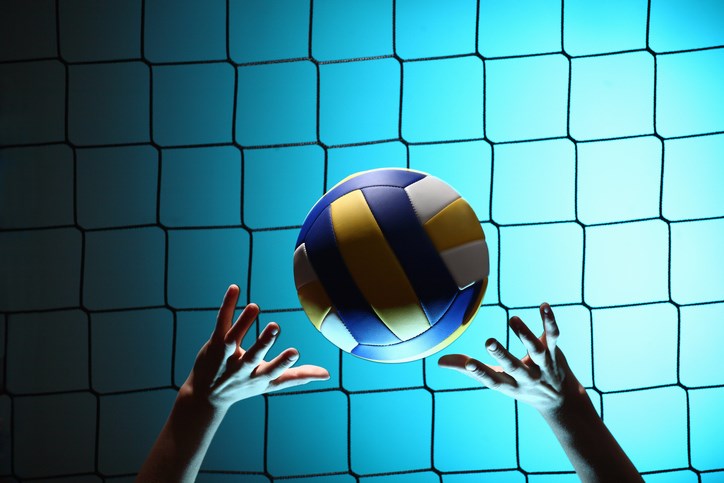 Player bouncing volleyball ball