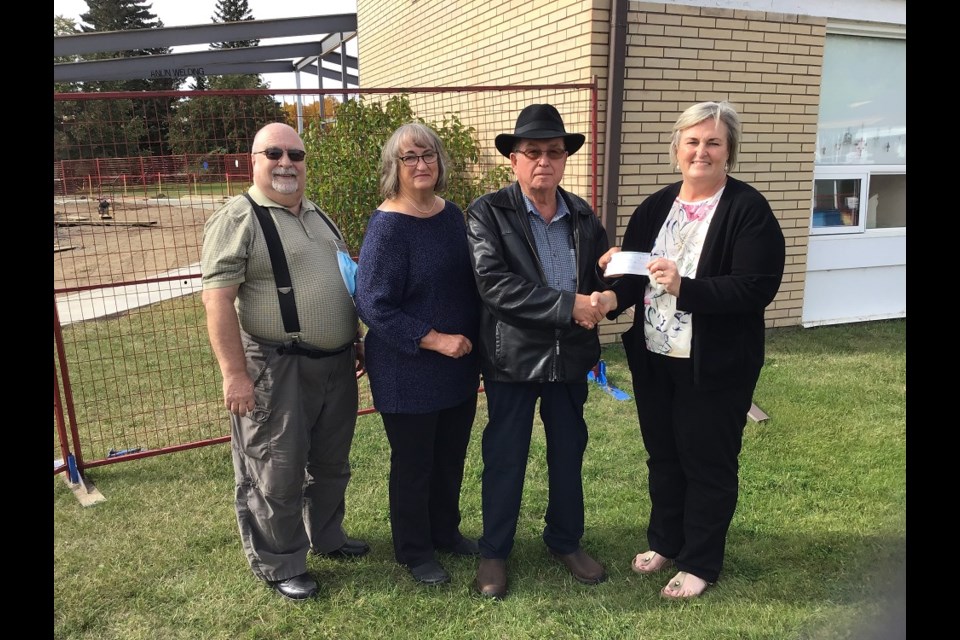 Seen left to right, board chair Claude Desnoyers, Helene and Albert Blais and Heather Beatch, as Blais presents a cheque for $10,000 towards the Villa Pascal renovation project. 