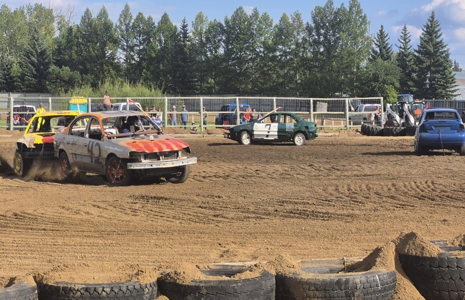 Flags are down! Drivers race around the ring, aiming at the other cars before hitting them.