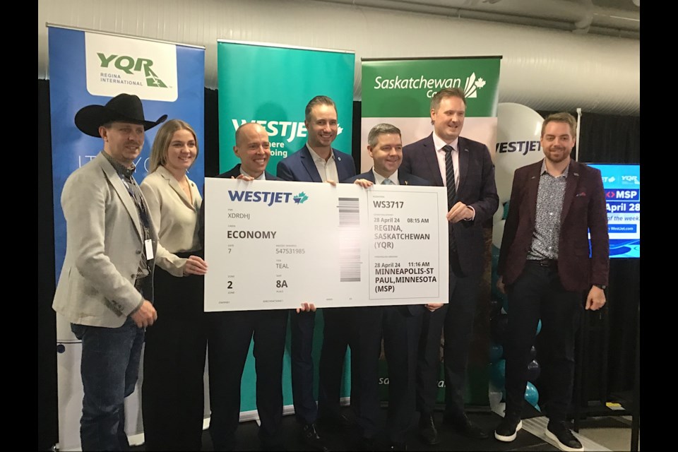 Officials from WestJet, Regina Airport Authority, and political leaders seen at the announcement of a direct route from Regina to Minneapolis-St. Paul.