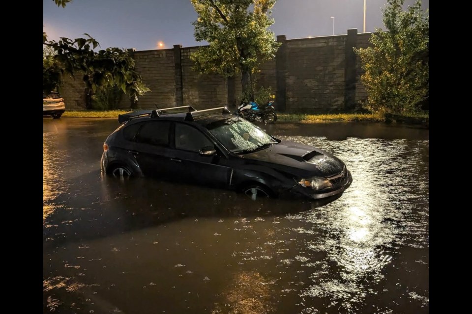 One of several cars of residents’ left on the flooded street in Avalon early Friday morning, Aug. 8.