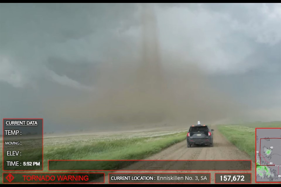 Connor Croff and his crew drive towards a tornado.