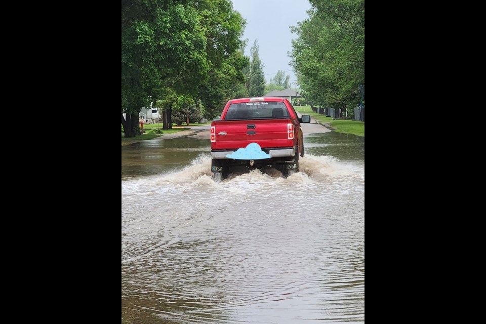 Some lower lying streets in town saw some flooding as storm drains worked hard to keep up with the more than one inch of rain that fell in a short period of time the early morning of June 6.