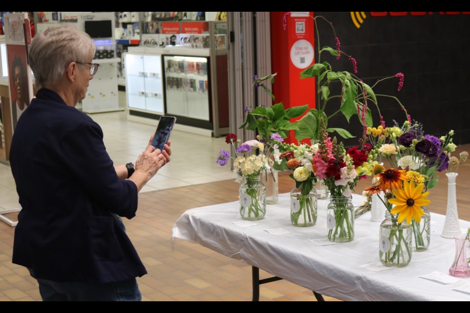 People were capturing images of the flowers in the show.