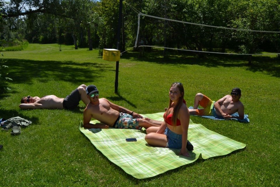 Enjoying a day off to sunbathe on Canada Day from left, were: Justin Metcalfe, Jesse Schiller, Brittany Fedirko and Keegan Bilanchuk