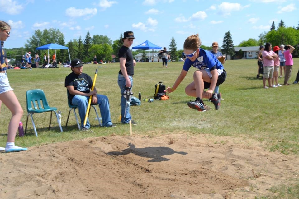 Blake Erickson flew over the sand pit in the Elementary track field meet held in Sturgis.