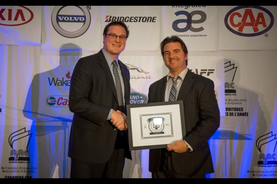 Michel Deslauriers on behalf of Alain Morin and the team of Le Guide de l'auto 2017, Runner-up of the Best Print Design Award presented by Kia Canada. Credit AJAC