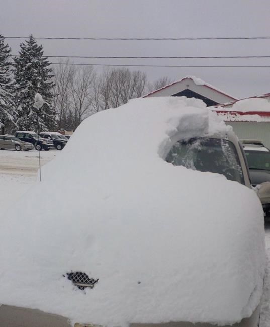 Police ticket 80-year-old man for too much snow on his car, then help clear snow