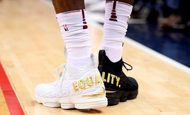 LeBron wears 1 black shoe 1 white shoe saying equality TimminsToday