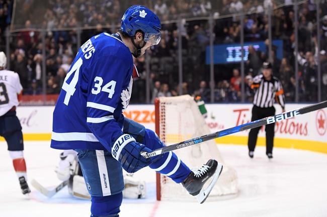 Download Auston Matthews, also known as 'Papi,' striking a pose during a  game session Wallpaper