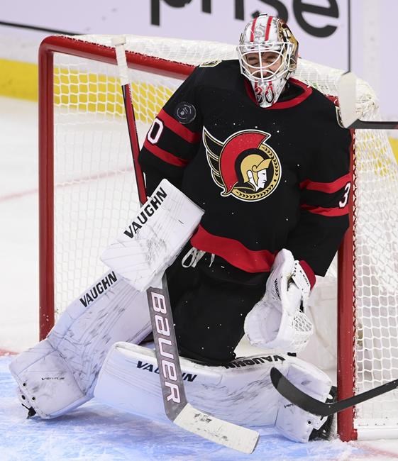 Brady Tkachuk of the Ottawa Senators pulls out a belt celebration