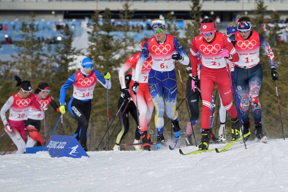 Yulia Stupak, of the Russian Olympic Committee, (2) leads a group during the women's 4 x 5km relay cross-country skiing competition at the 2022 Winter Olympics, Saturday, Feb. 12, 2022, in Zhangjiakou, China. Canada finished ninth in the race. (AP Photo/Aaron Favila)