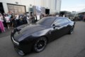 Gas-powered muscle cars drive into the sunset, turn electric