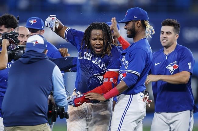 Jays clinch wild-card spot on day off, will celebrate Friday - The