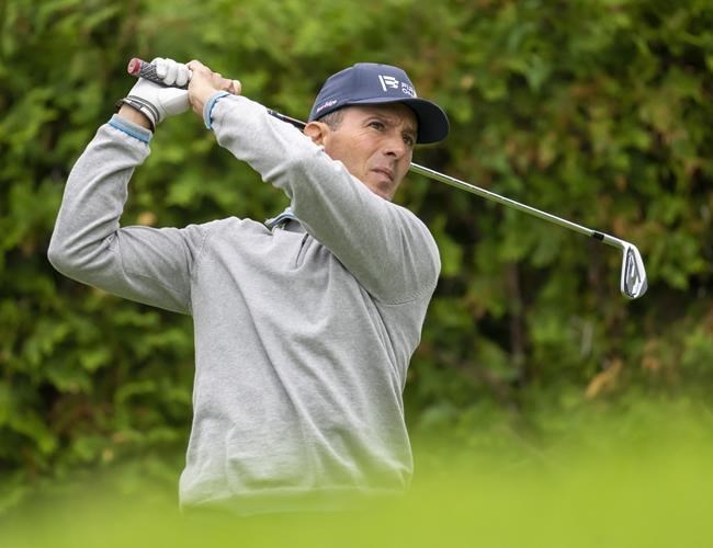 Canadian golf great Mike Weir closes the day on the Toronto Stock Exchange