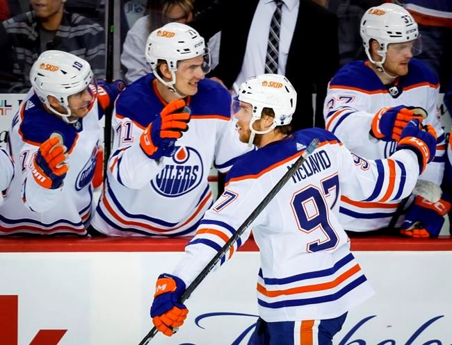 Oilers rally in OT to beat Flames 2-1