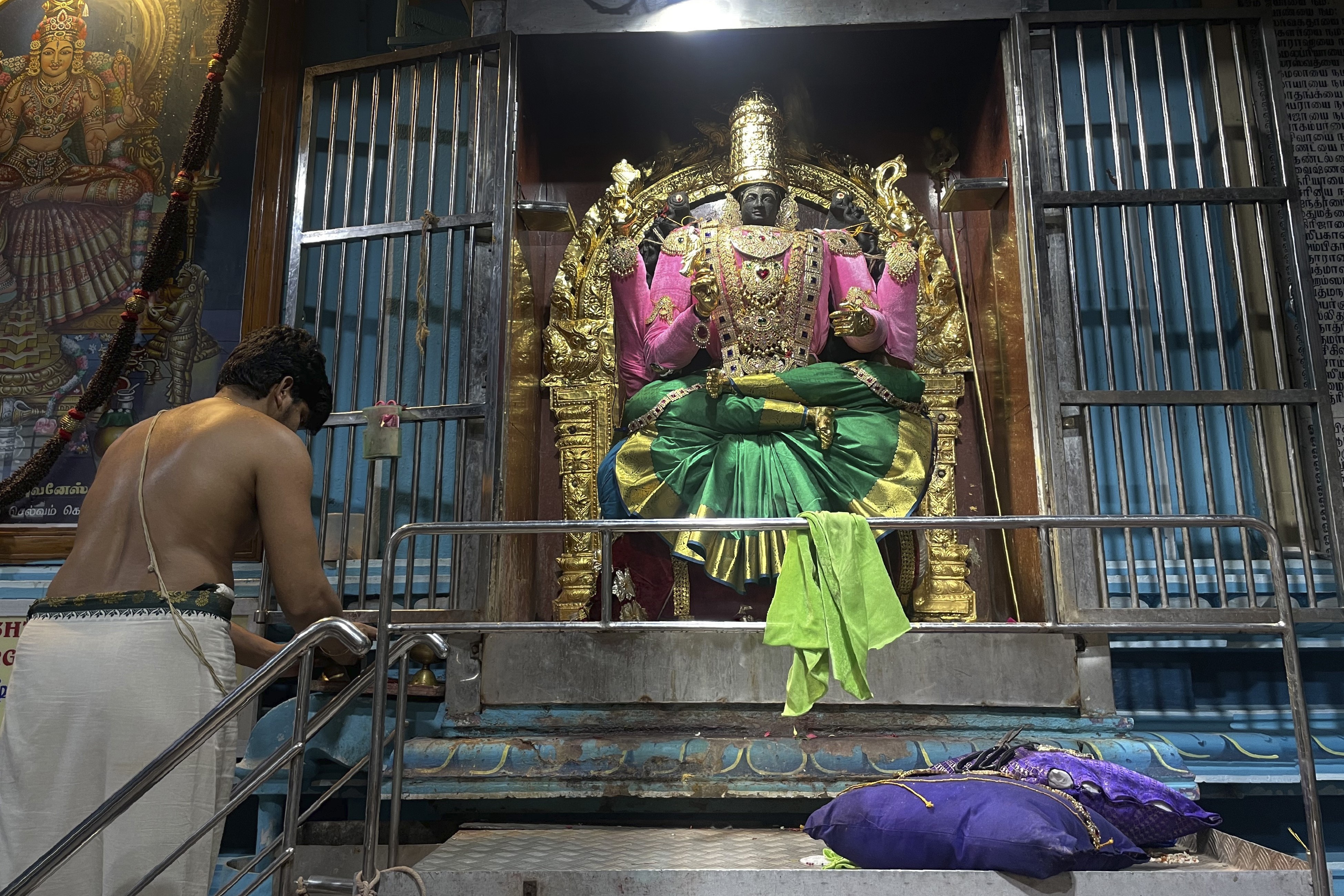In India, deity decorating a calling for Hindu temple artist