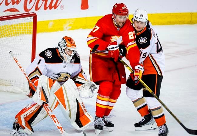 Andrew Mangiapane has 2 goals and an assist, Flames beat Jets 5-3 in opener, Hockey
