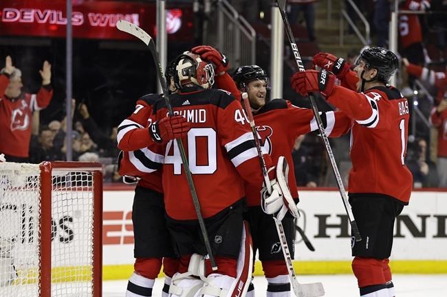 Hughes scores 2 to give Devils 4-3 win over Blackhawks in OT