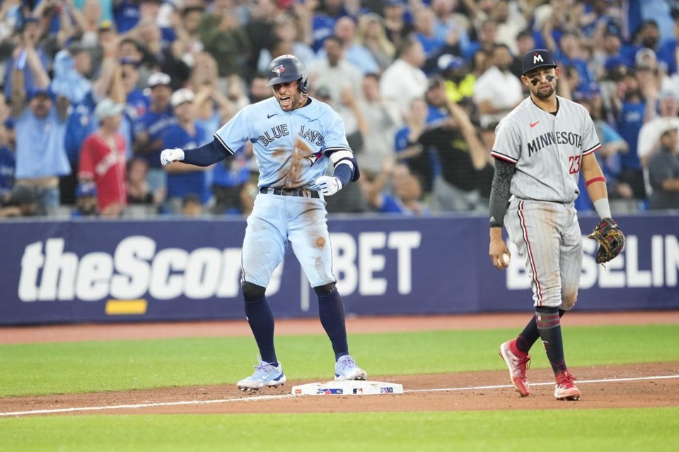 Toronto Blue Jays' Adam Cimber follows through on his delivery to