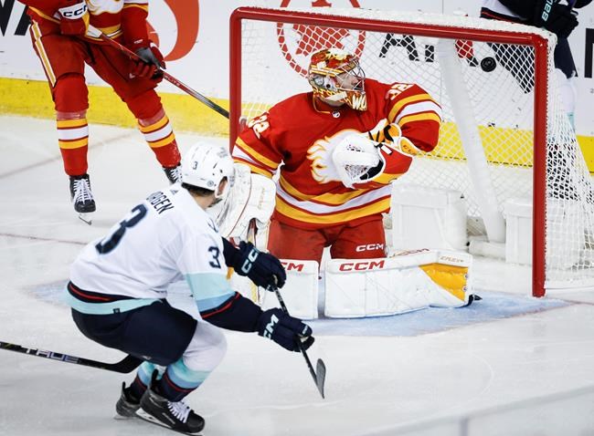 Kraken score 3 goals in 3rd period for 1st win over Flames - The