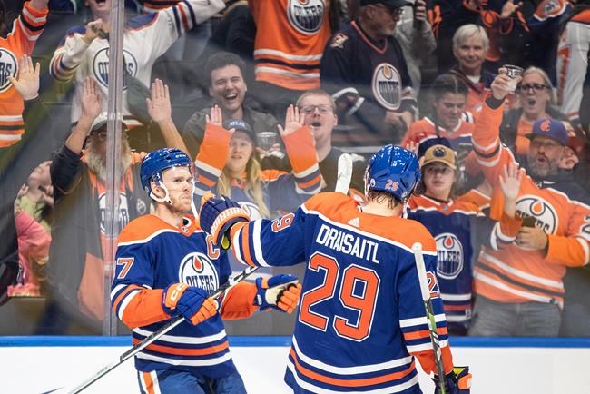 Oilers rally in OT to beat Flames 2-1