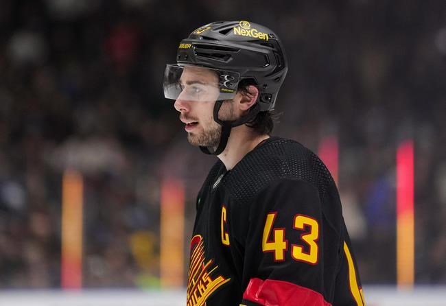 Canucks shop hughes jersey