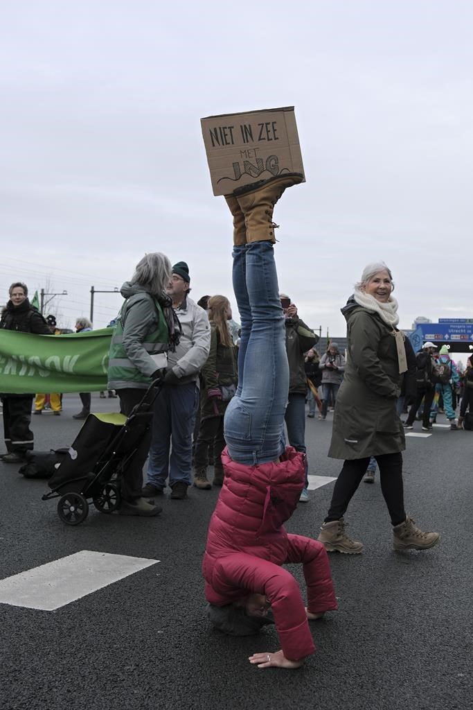 Climate activists from Extinction Rebellion target bank and block part of  highway around Amsterdam 