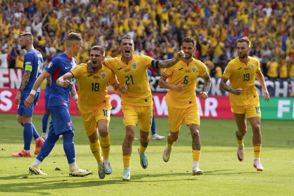 Romania and Slovakia draw 11 to send both into the round of 16 at Euro