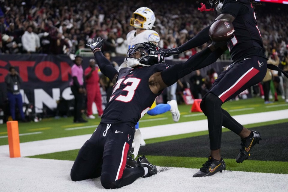 Texans intercept Herbert a career-high 4 times in a 32-12 win over Chargers  in wild-card playoff - Victoria Times Colonist