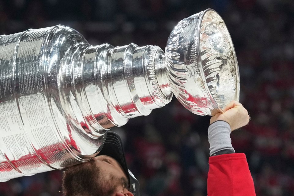 FILE - Florida Panthers center Sam Reinhart (13) kisses the Stanley Cup after defeating the Edmonton Oilers in Game 6 of the NHL hockey Stanley Cup Final Tuesday, June 17, 2025, in Sunrise, Fla. (AP Photo/Lynne Sladky, File)