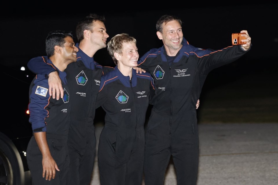 SpaceX Falcon 9 crew, Shubhanshu Shukla of the Indian Space Research Organization, from left, Tibor Kapu of Hungary, commander Peggy Whitson, and Slawosz Uznanski-Wisniewski of Poland, pose for a selfie before departing for a launch to the International Space Station at the Kennedy Space Center in Cape Canaveral, Fla., Tuesday, June 24, 2025. (AP Photo/Terry Renna)