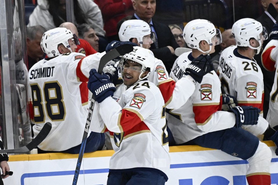 FILE - Florida Panthers right wing Justin Sourdif (24) is congratulated by defenseman Nate Schmidt (88) after scoring against the Nashville Predators during the second period of an NHL hockey game, Tuesday, Feb. 25, 2025, in Nashville, Tenn. (AP Photo/John Amis, File)